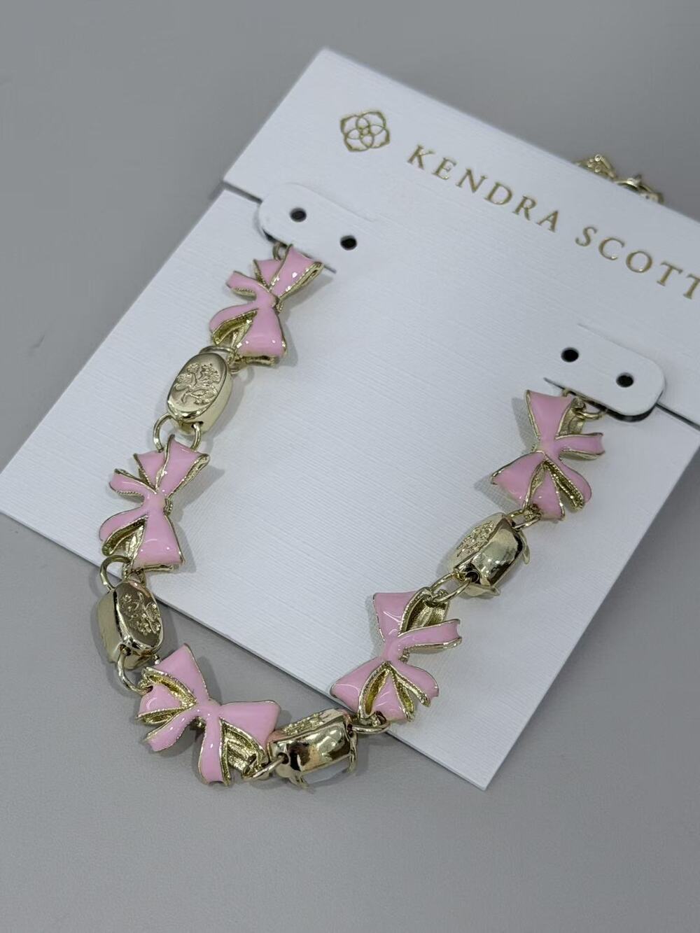 Kendra Scott Pink Enamel Bow Link Gold Tone Bracelet